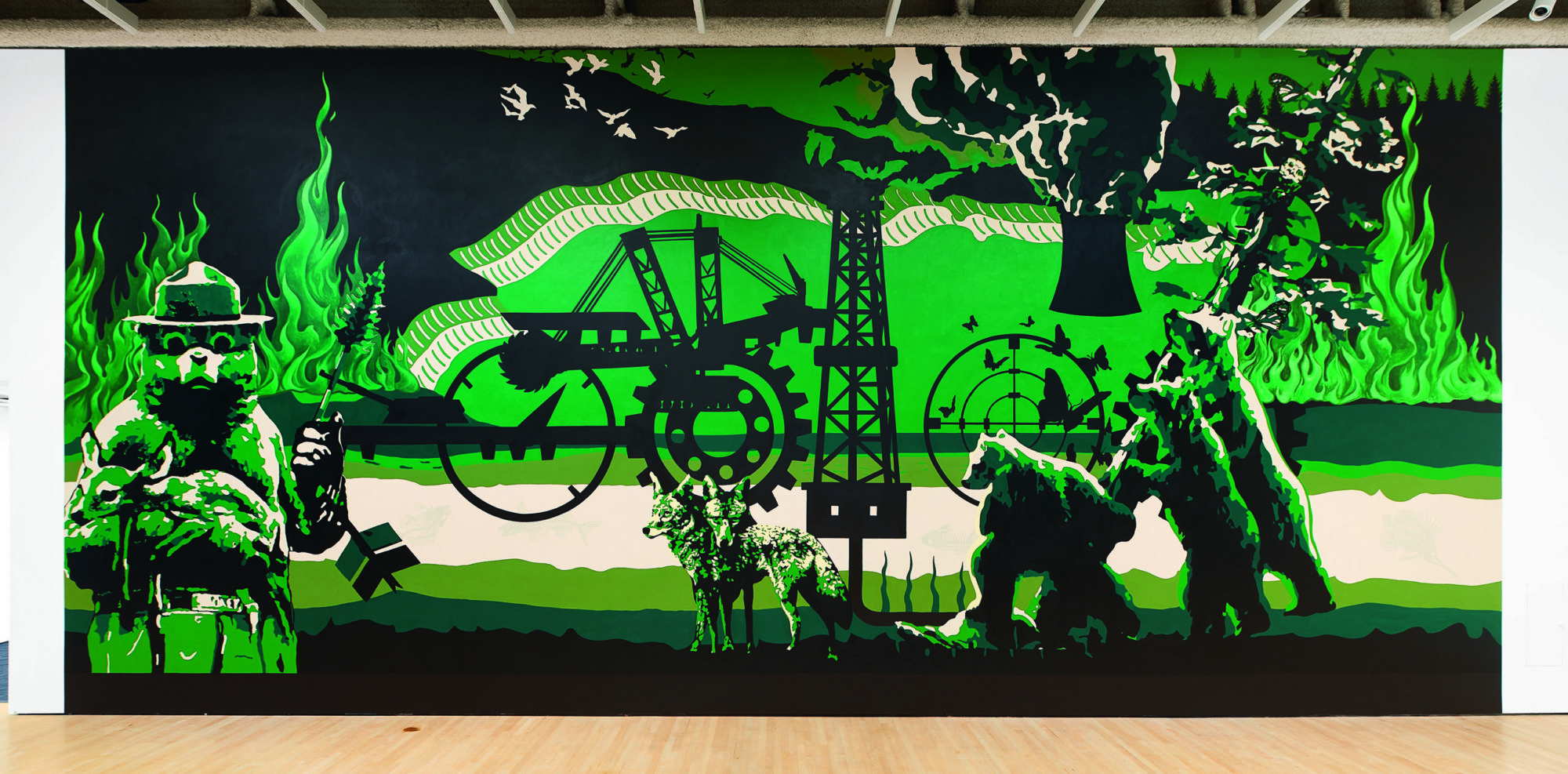 shot of work by Minerva Cuevas; a green, black and tan mural containg wolves, bears, oil pump, butterflies, and one Smoky the Bear