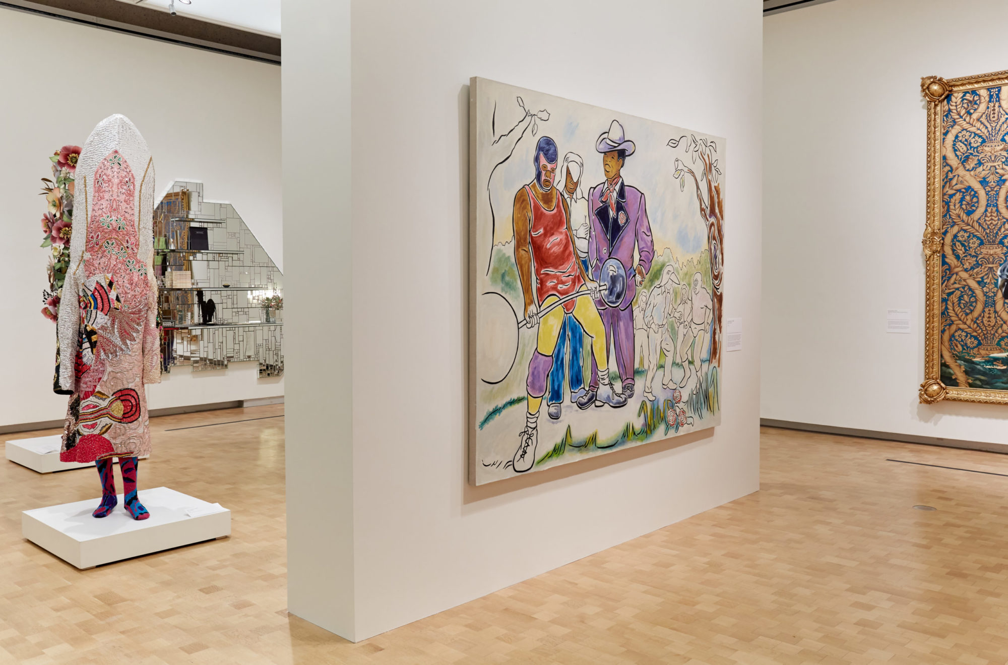 Installation view of '30 Americans;' To the left of frame stands a tall, ornately styled outfit, the middle hangs a large painting of a weight-lifter and just out of frame is an ornately framed painting