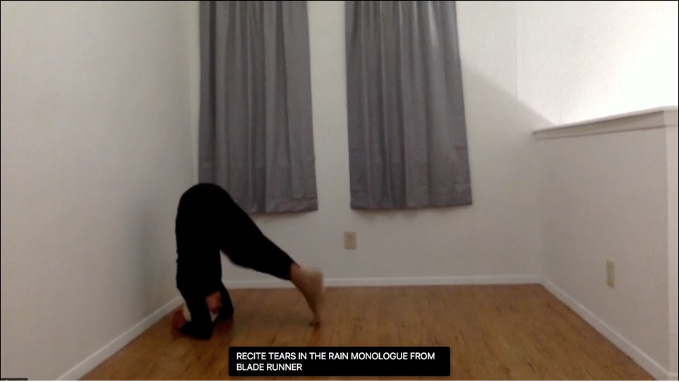 Person (Alexa Capareda) in an empty room, bent over with her elbows to the floor and her toes touching the ground, likely about to enter an elbow-stand. The words 