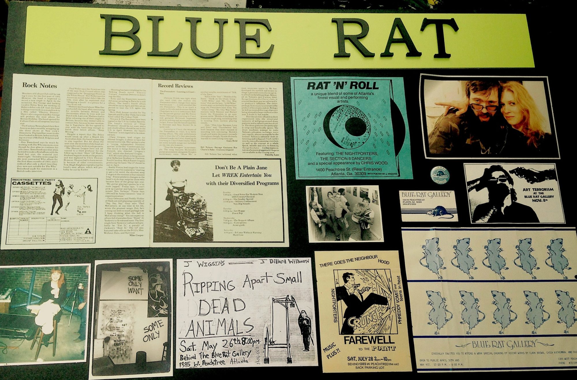 A photograph of a Blue Rat Poster, with images and documentation of various events.