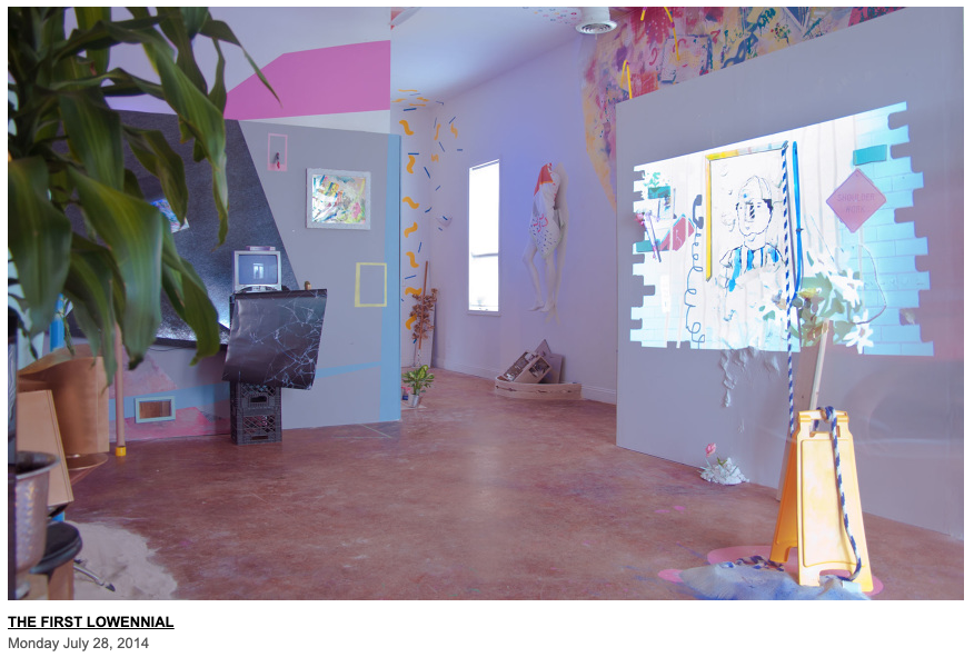 A photograph of an installation view with pink, blue and purple tones. Some images are projected, and others are sculptures on and near the room's walls. Leaves of a tree poke out from the upper left corner.