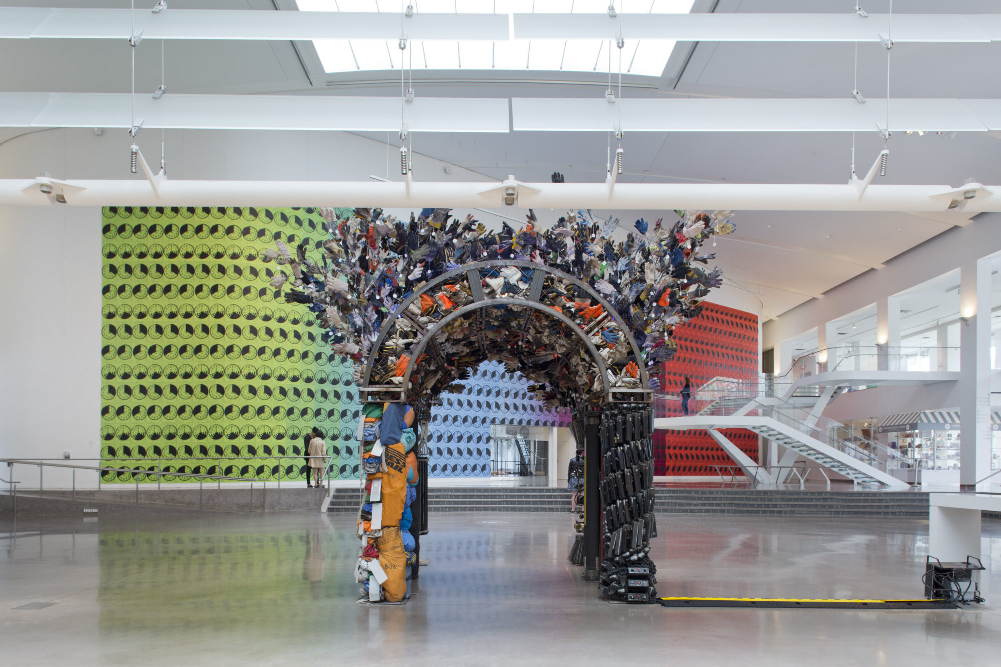 Large multicolor sculpture in white gallery space.