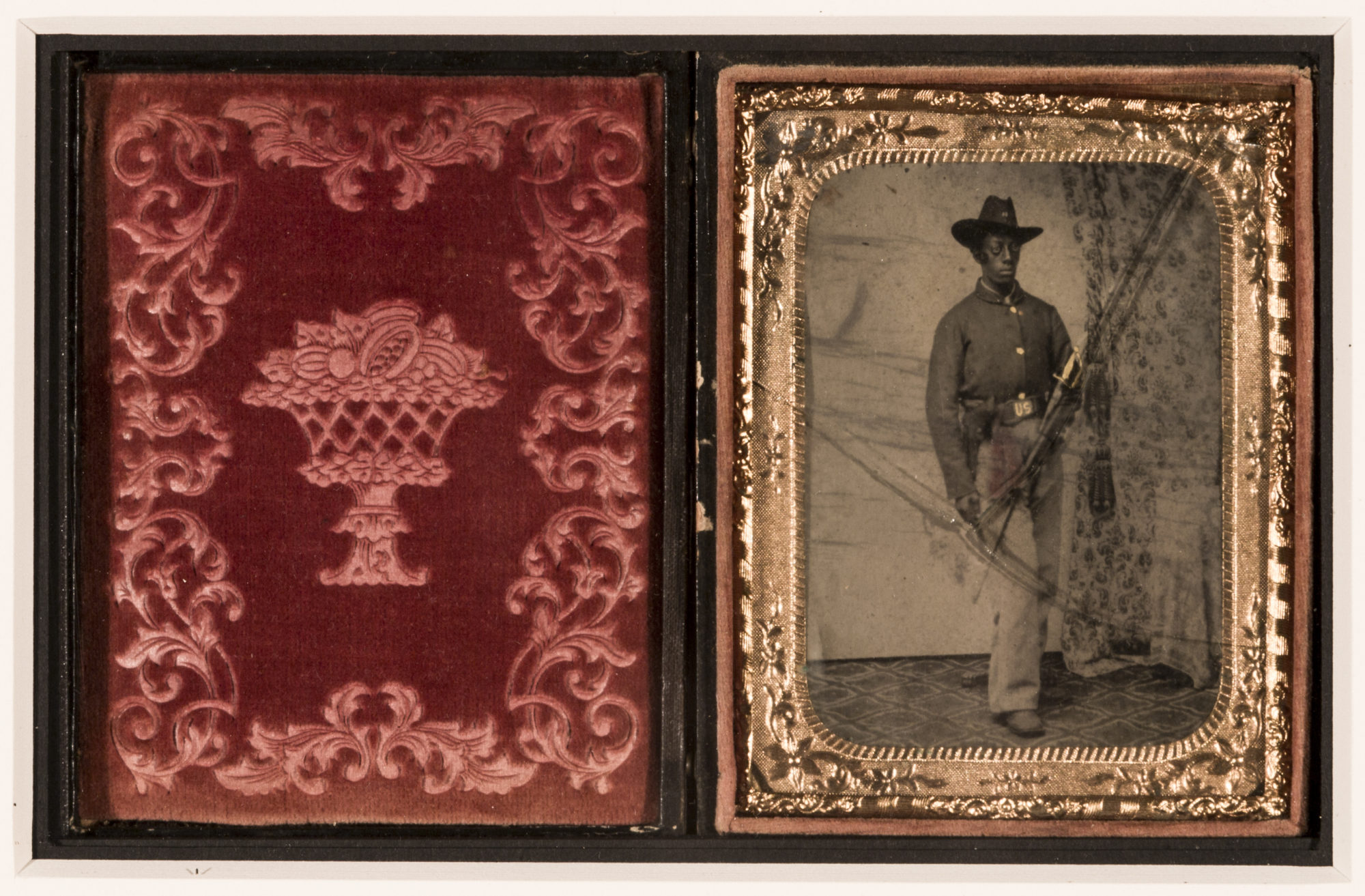 Diptych with a red design on the left and a gold-framed sepia photo of a man in military uniform on the right.