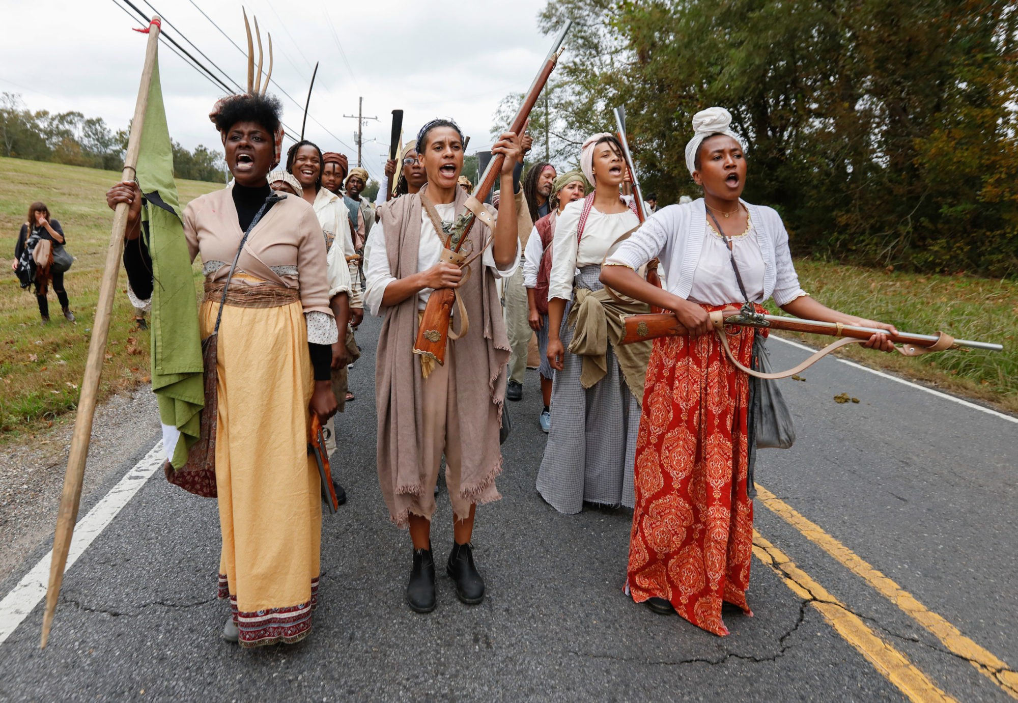 Documentation of the Slave Rebellion Reenactment, a community engaged performance initiated by Dread Scott in the outskirts of New Orleans