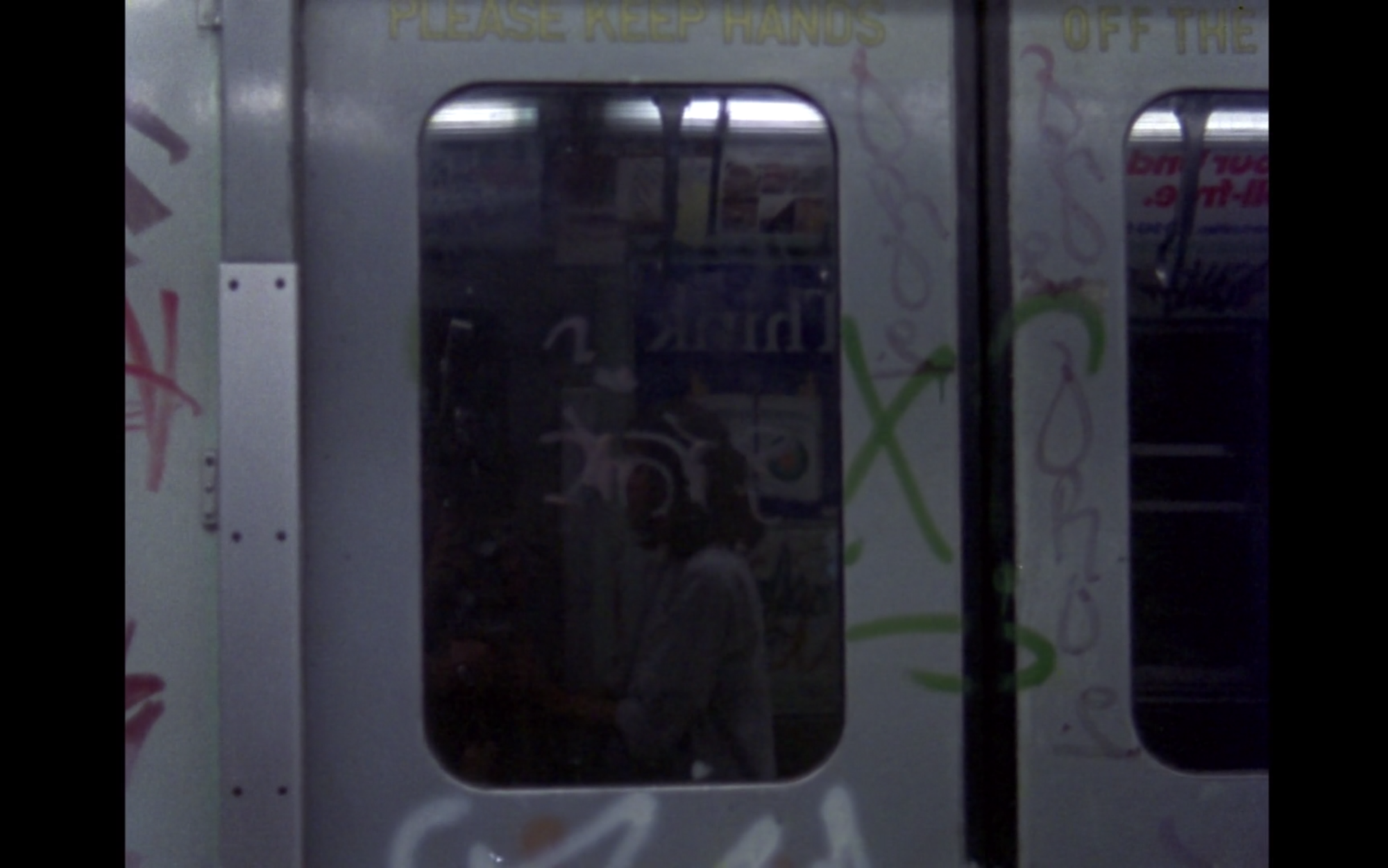 Screenshot from film News From Home of subway train doors
