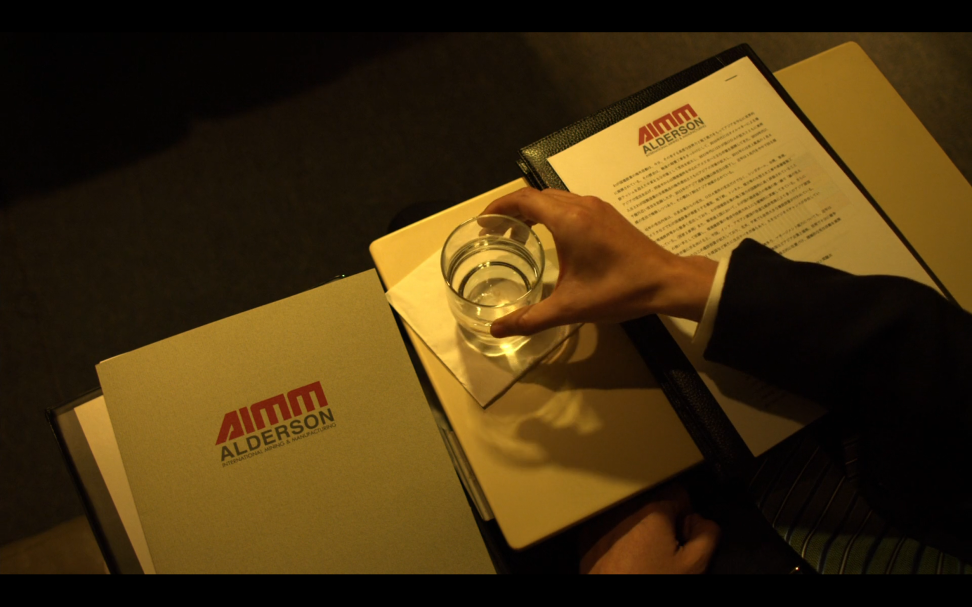 top-down view of a table top covered in official documents with the letterhead 