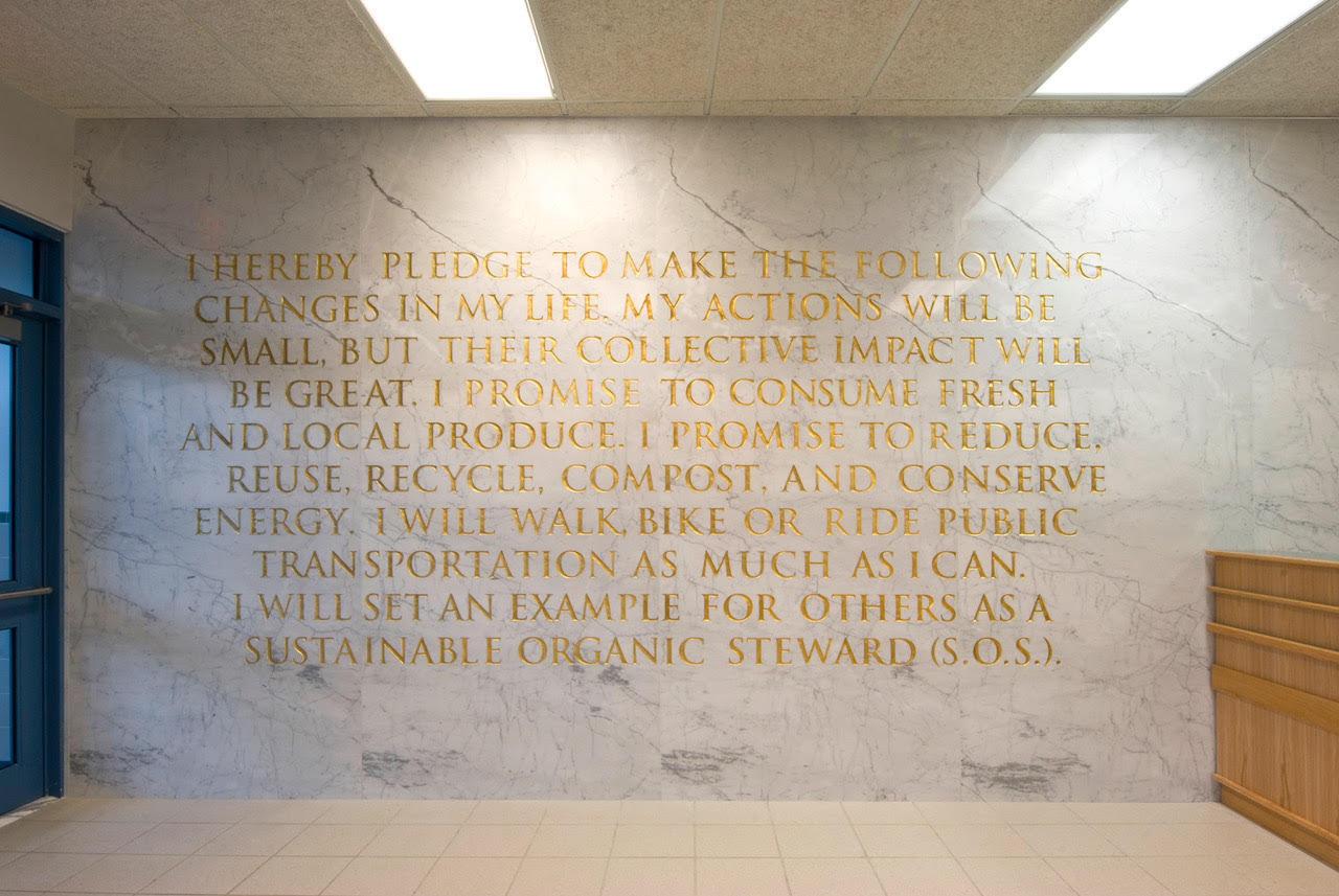 gold colored inscription on marble wall