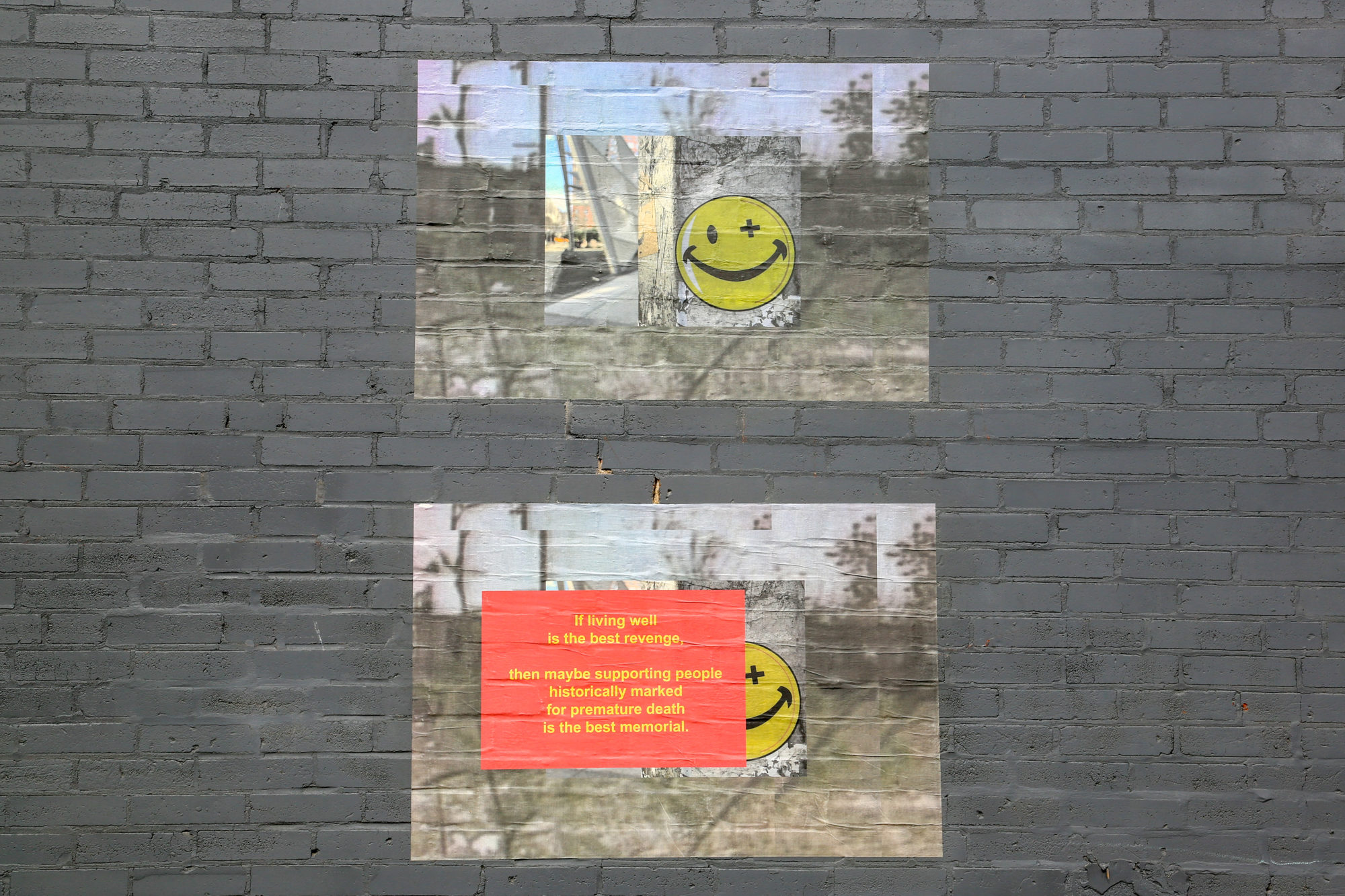 Pictures of smiley faces and words painted on gray brick wall