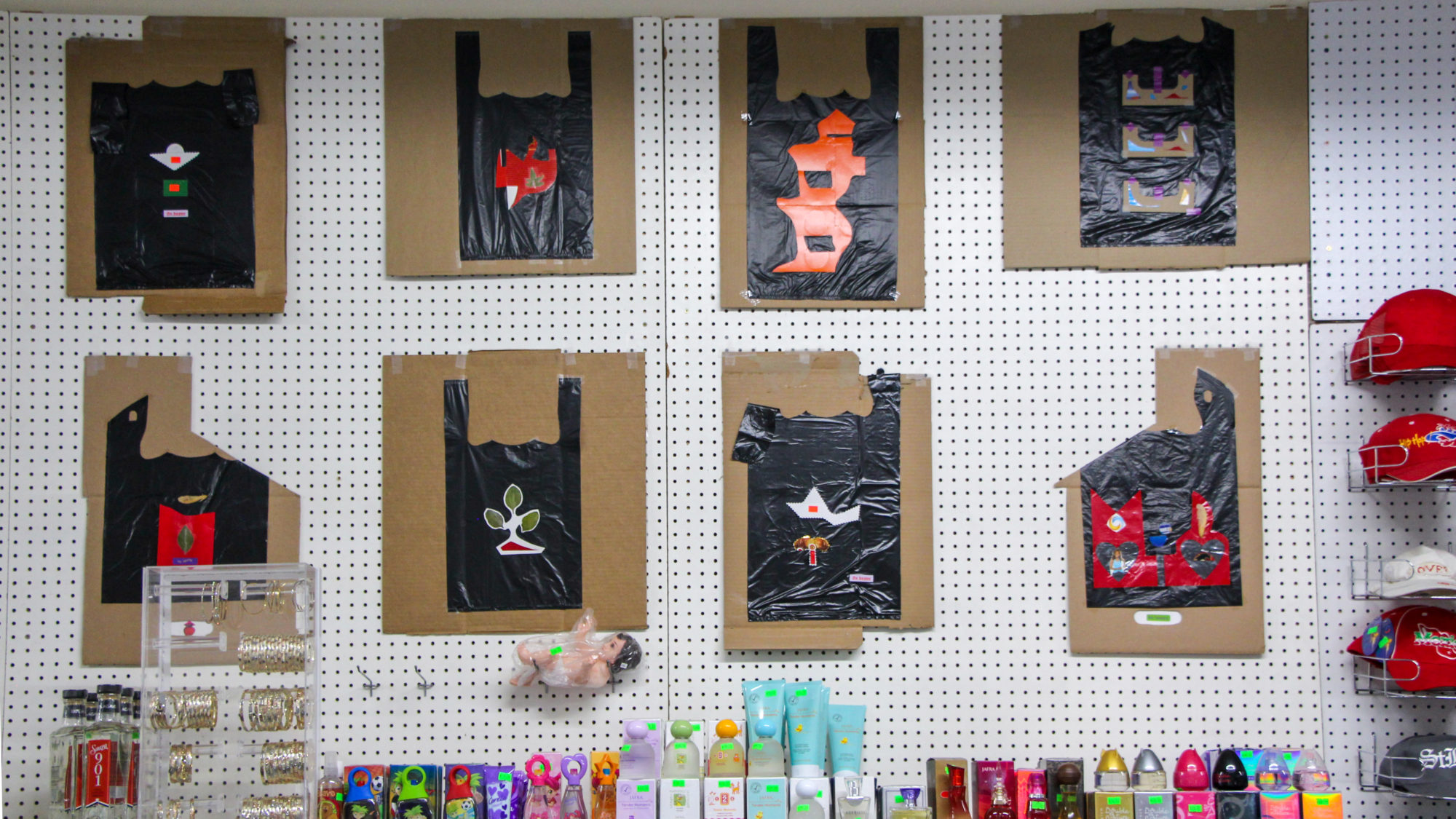 Plastic bags posted on cardboard mounted on wall of convenience store