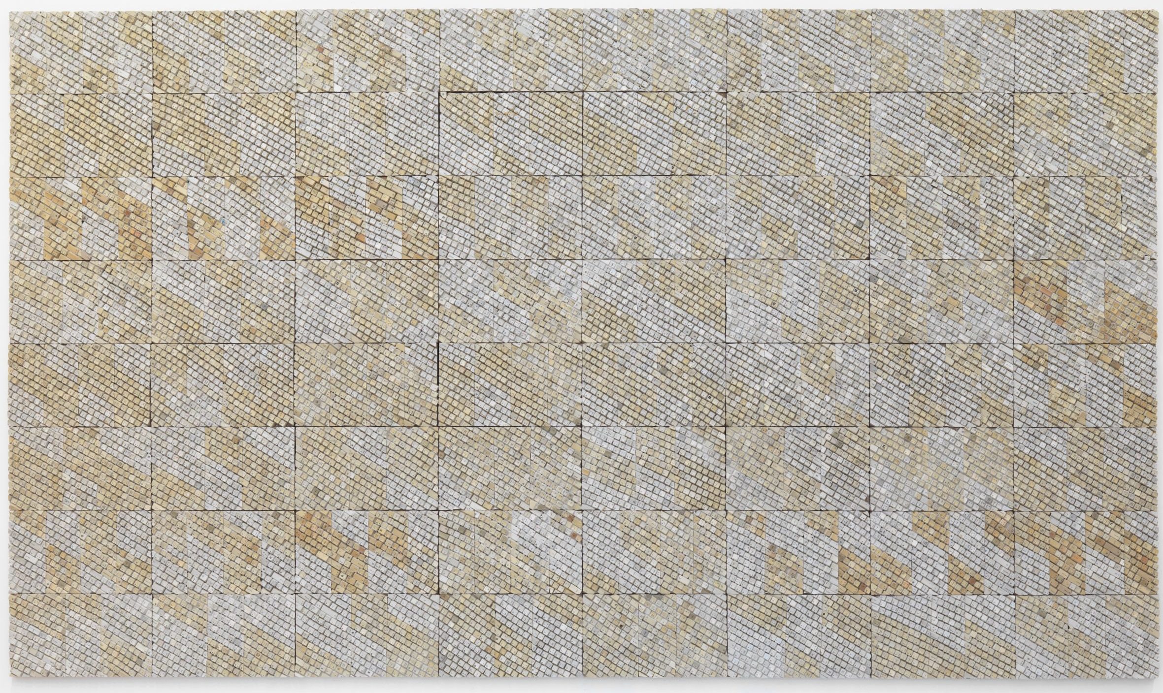 A square made of smaller beige squares. The beige is mixed with streaks of a darker shade.