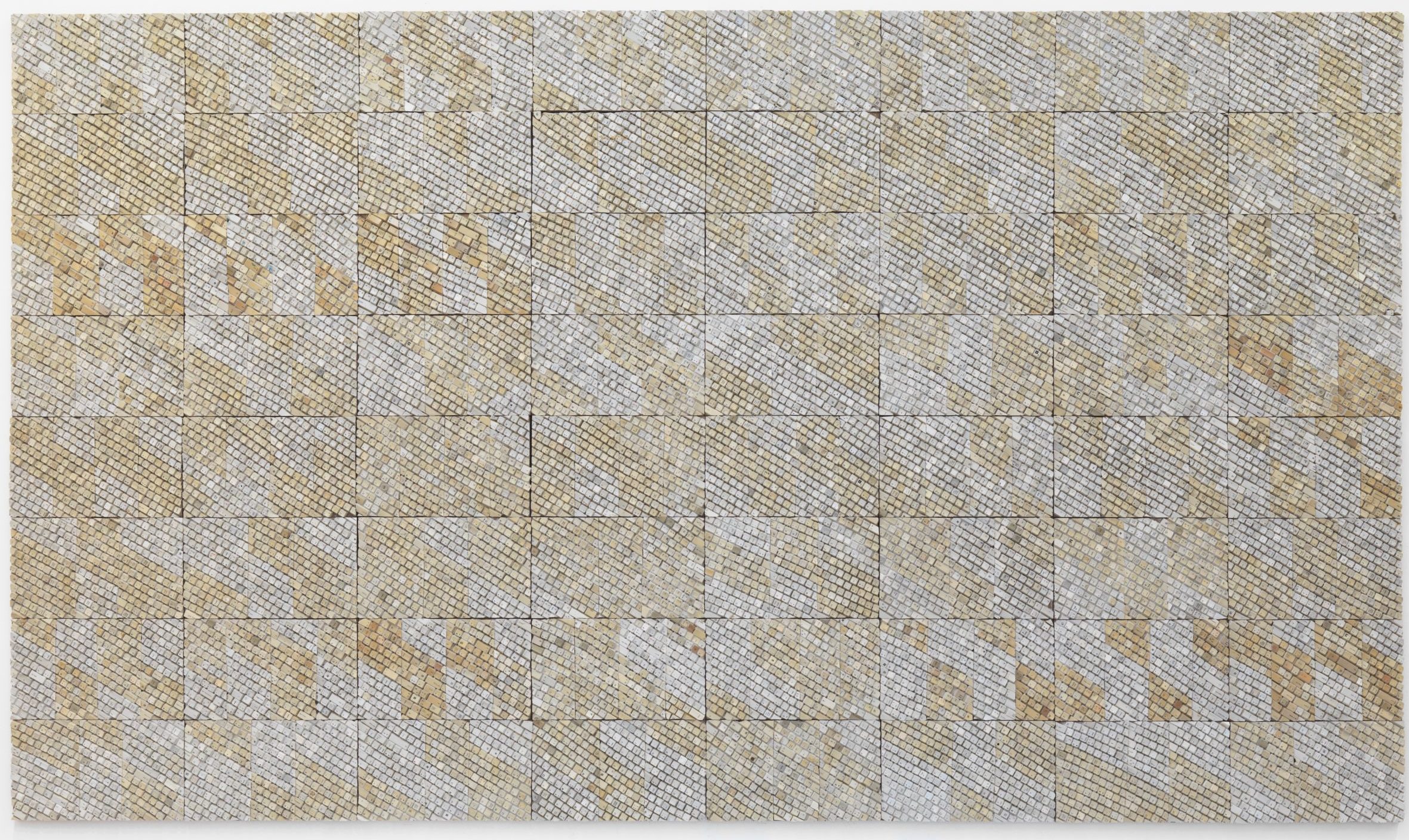 A square made of smaller beige squares. The beige is mixed with streaks of a darker shade.