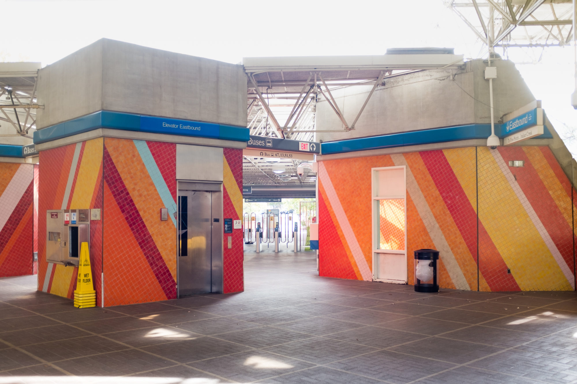 Colorfully tiled murals in a train station near the entrance