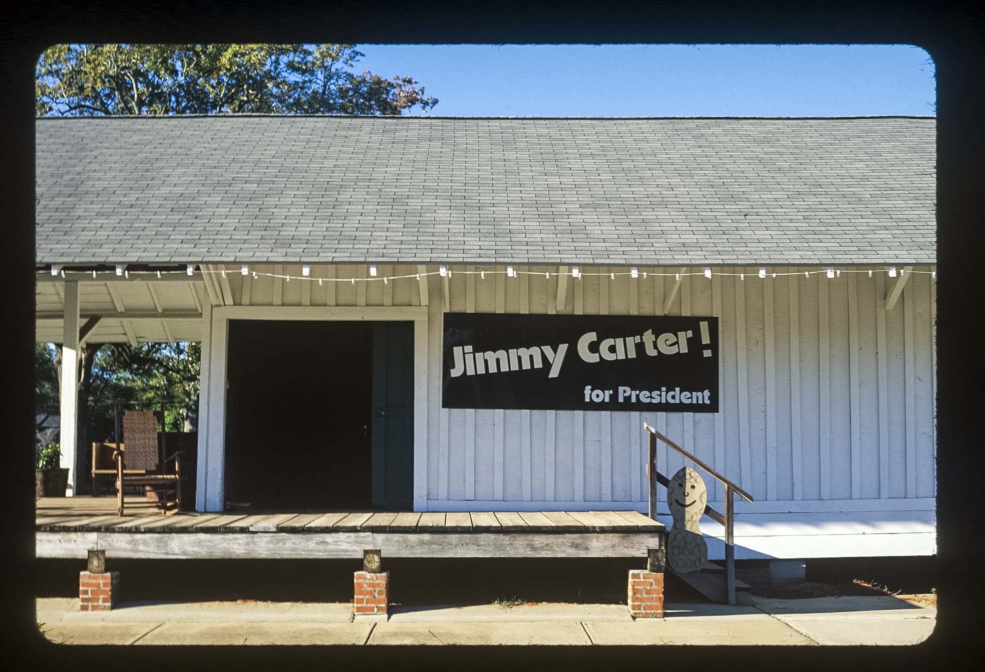 A 'Jimmy Carter! for President' sign on a white building