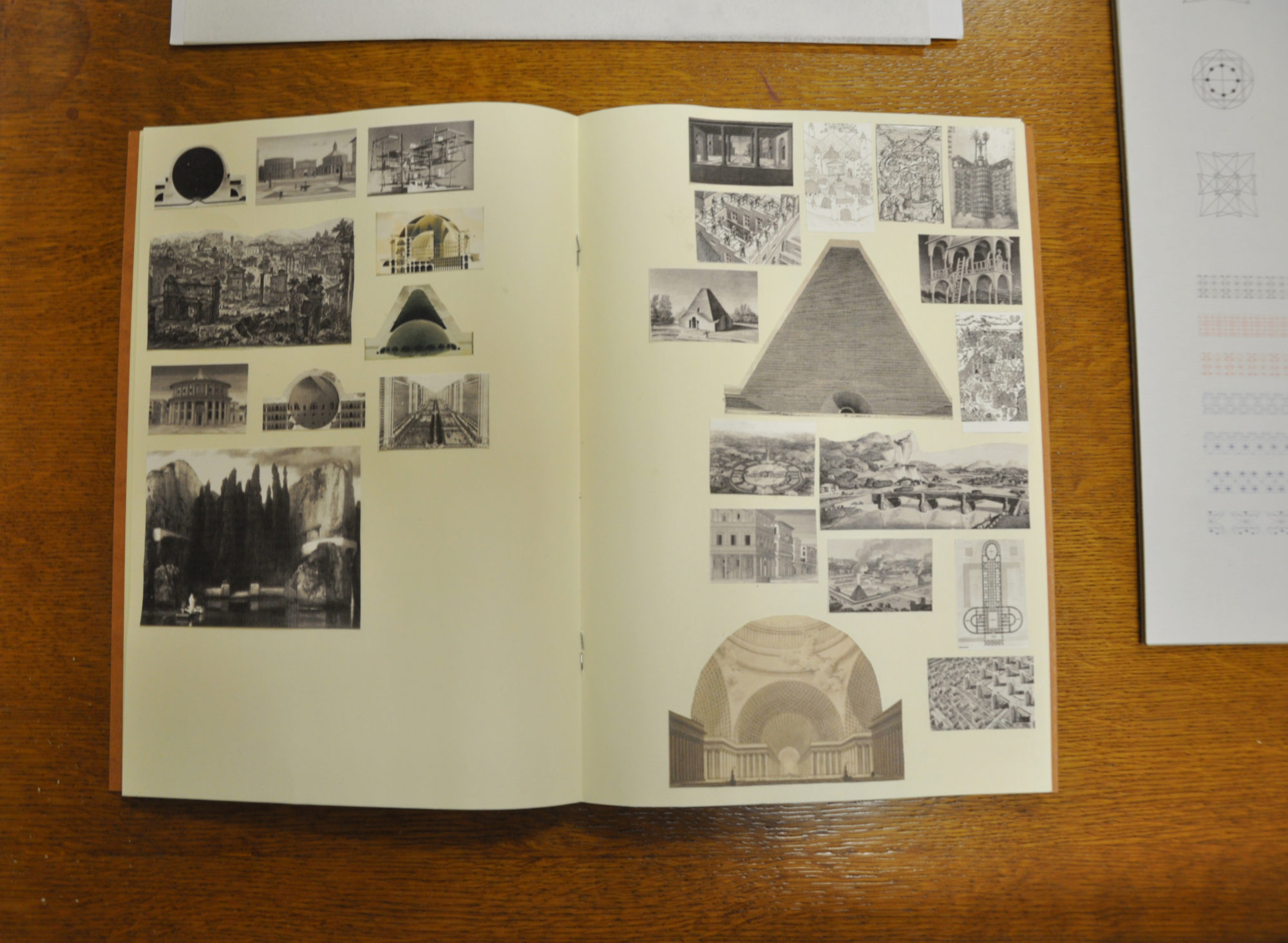 an open book with cut-out black and white images pasted on the pages