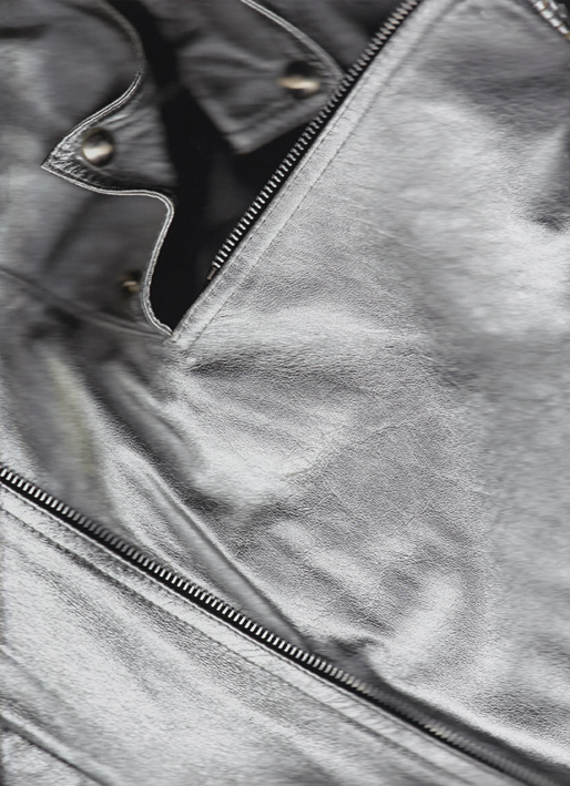 A close up of a black leather jacket and zippers