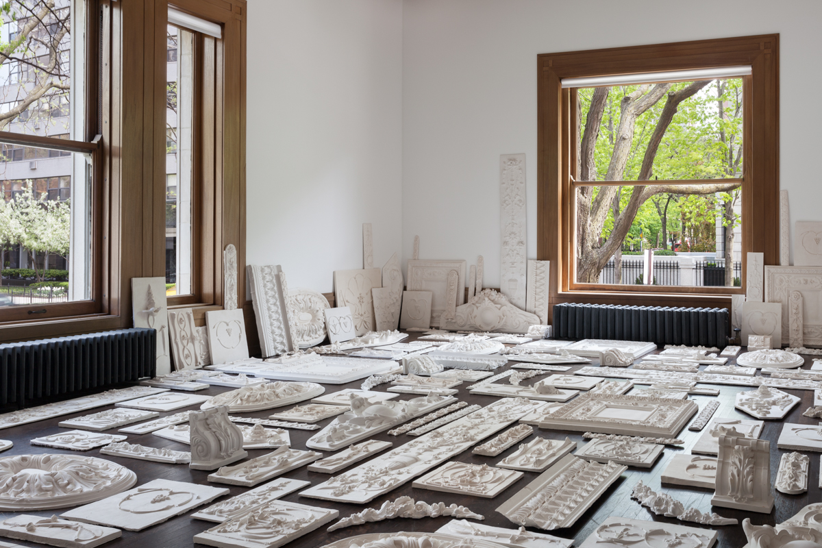 An image of pieces from Michael Rakowitz, sitting in a room.