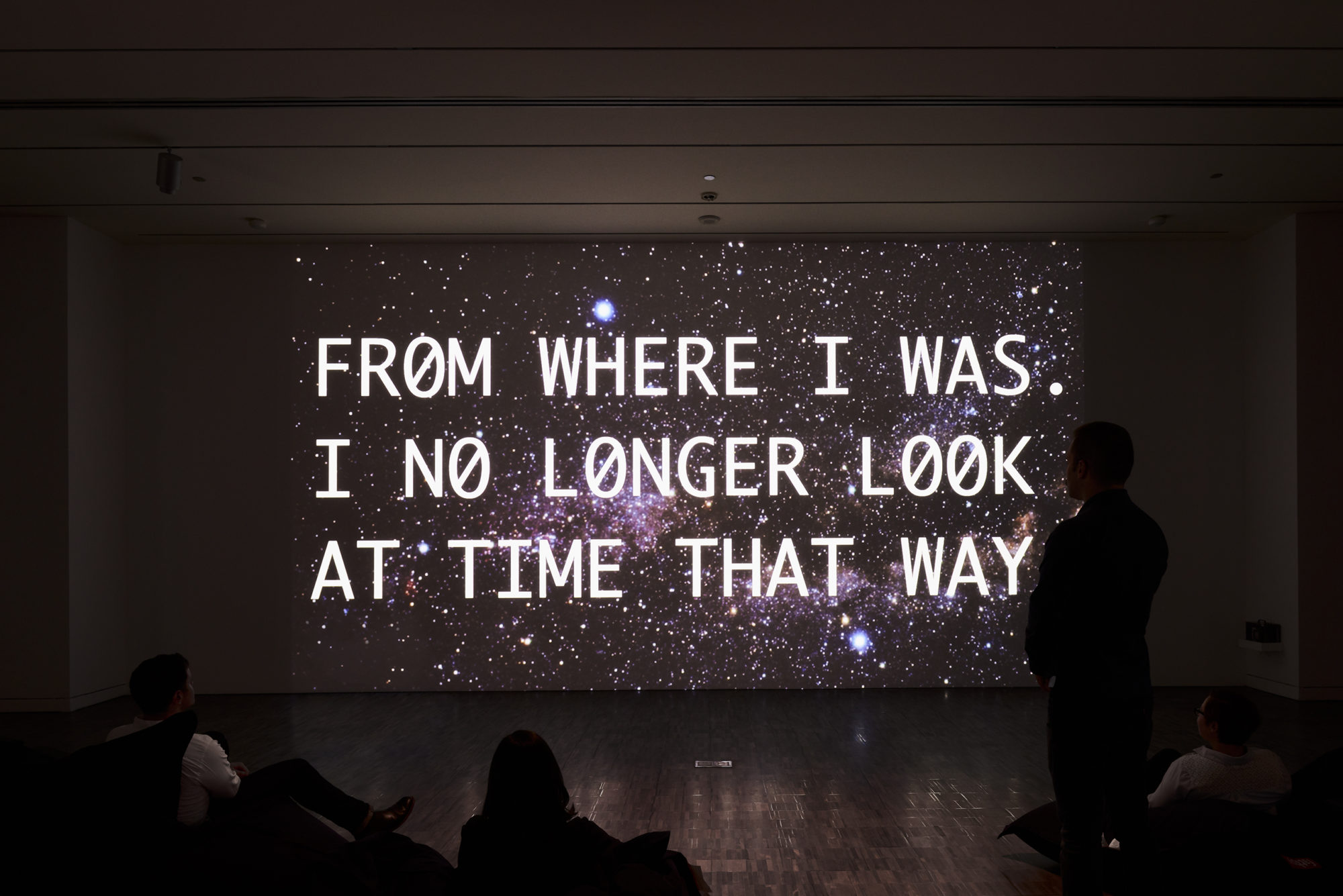 Four people viewing Young-Hae Chang's Heavy Industries,2017 at the Asian Art Museum, San Francisco.