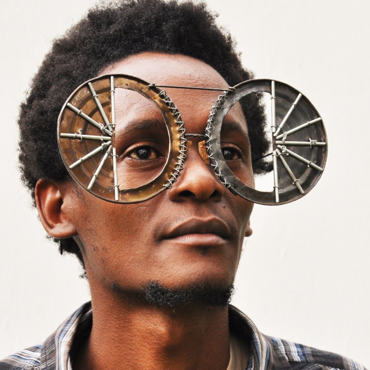 Man wears a pair of futuristic round glasses