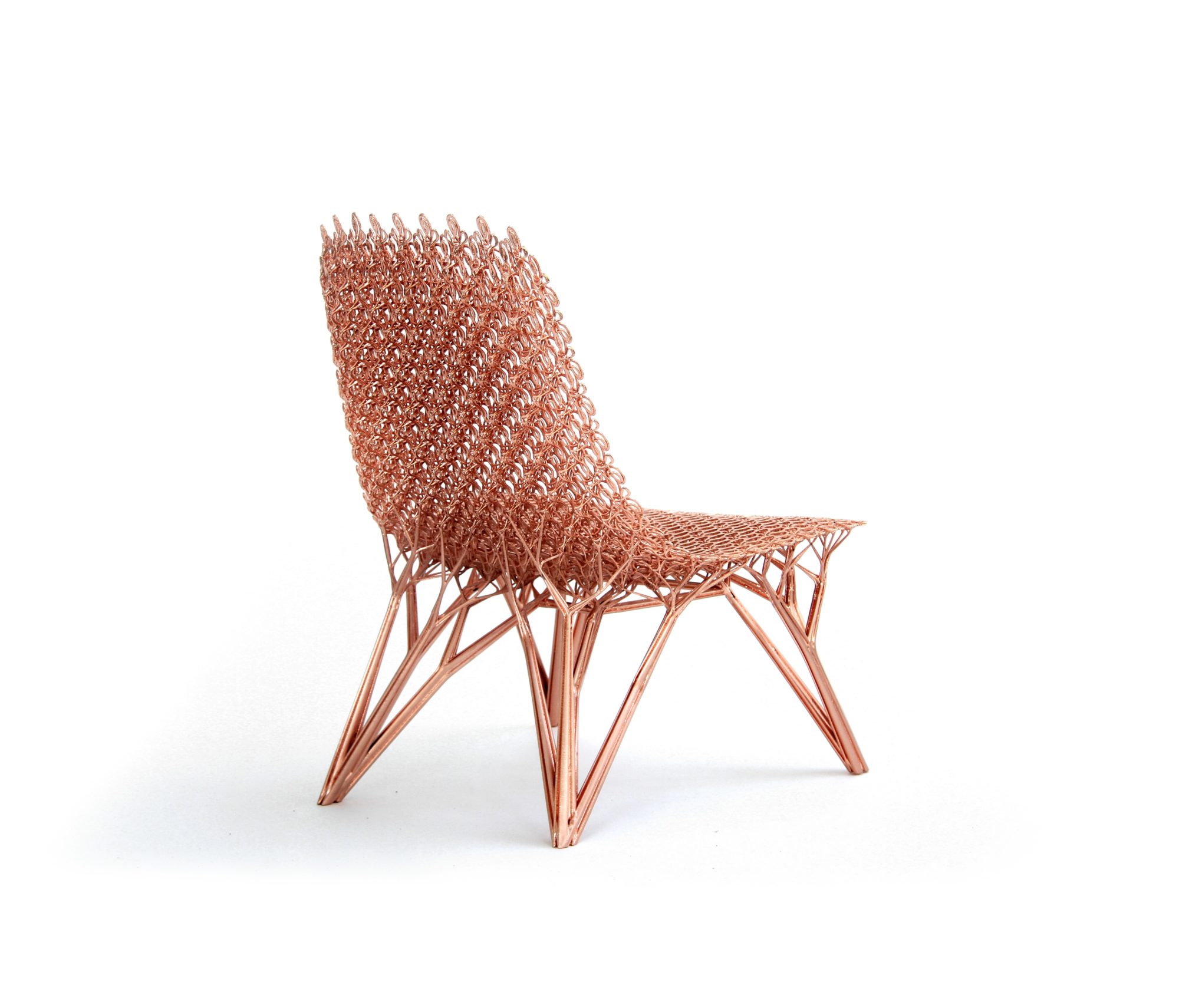 the side of a copper-colored, coil-textured chair with branch-like legs