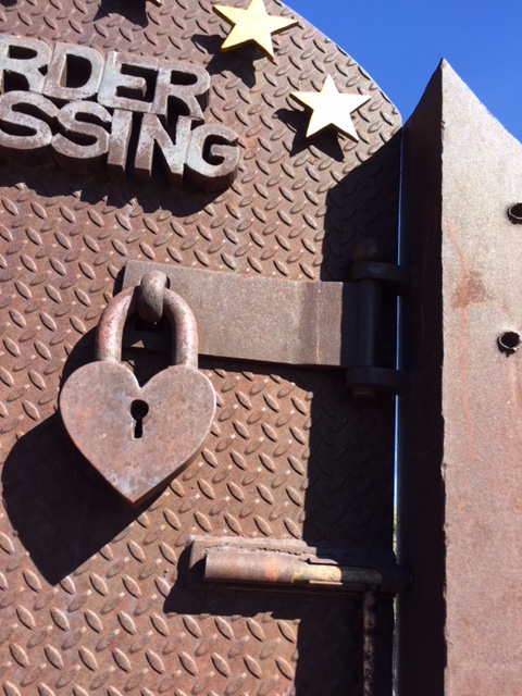 painted steel with rust patina with heart shaped lock