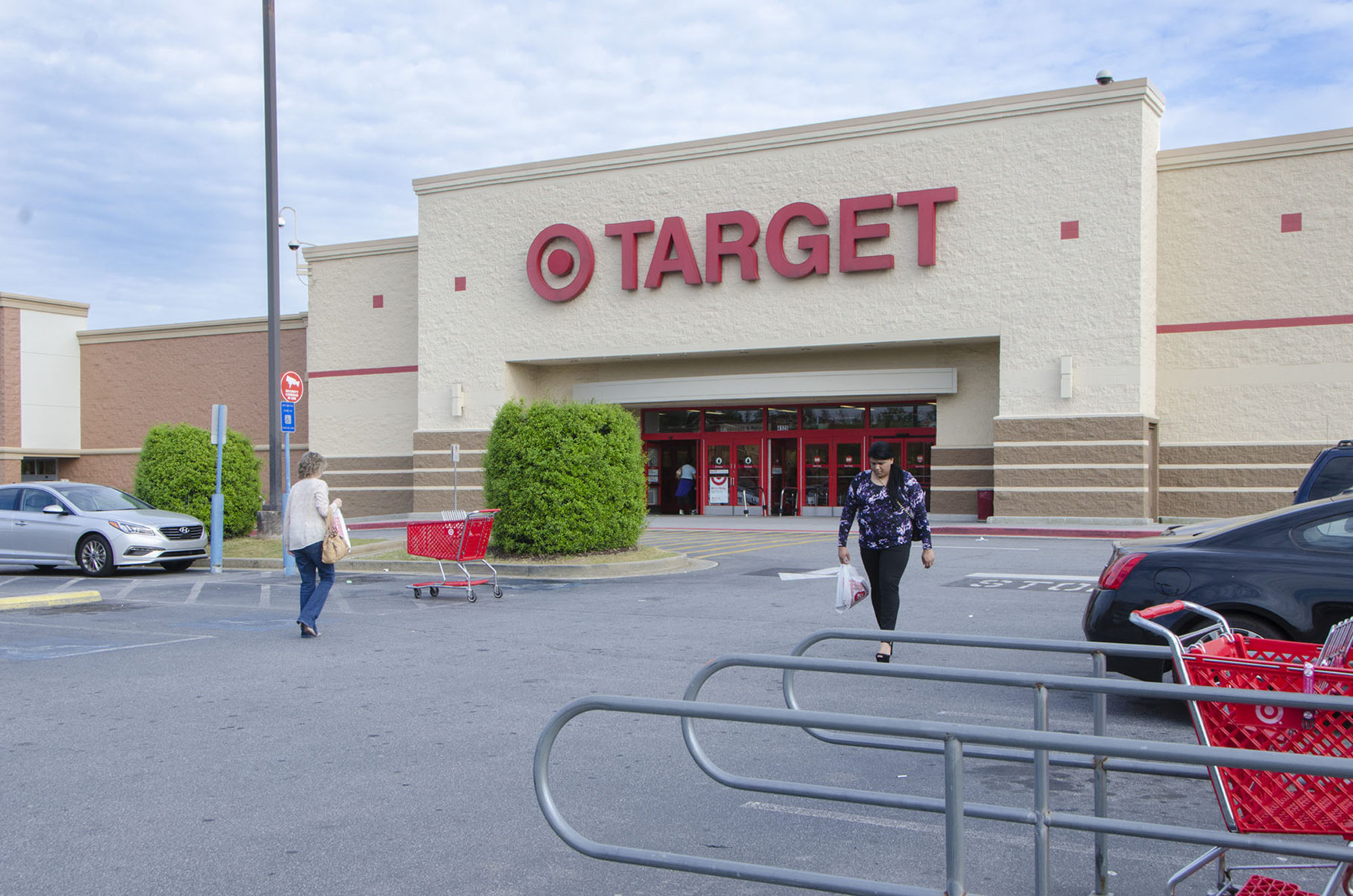 A woman leaves Target with a grocery bag