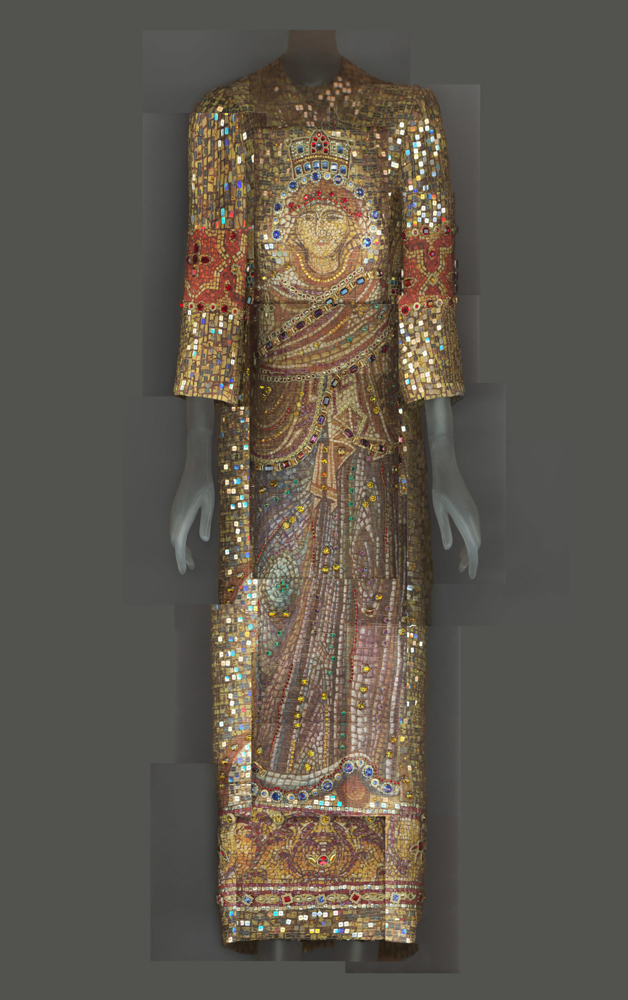 gold and colorful gown with three quarter-length sleeves and a mosaic pattern with the image of a saint over the torso and legs