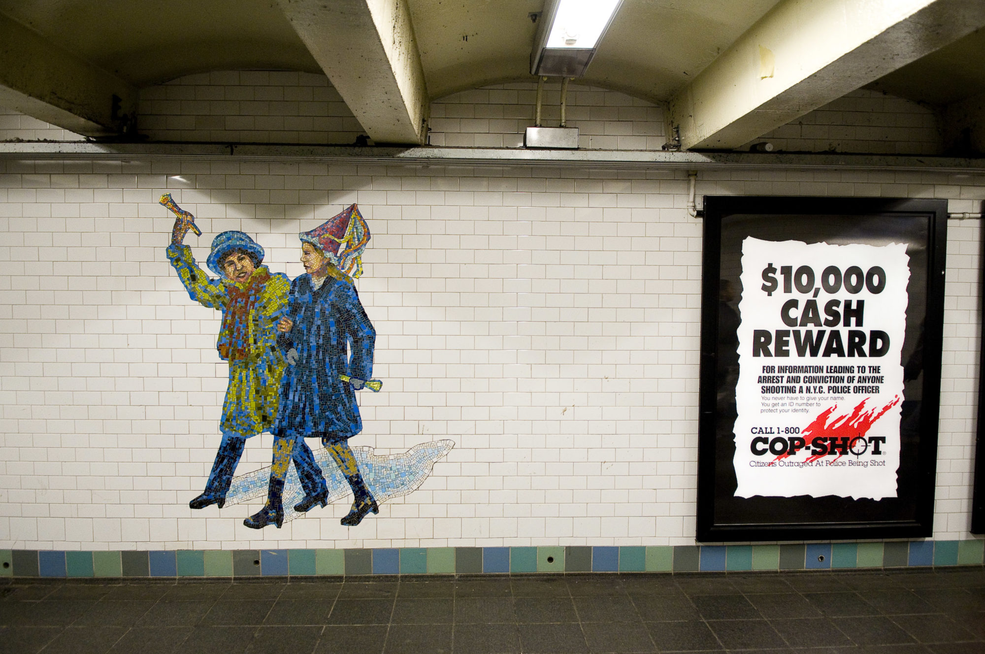 A mosaic at a subway station of two 