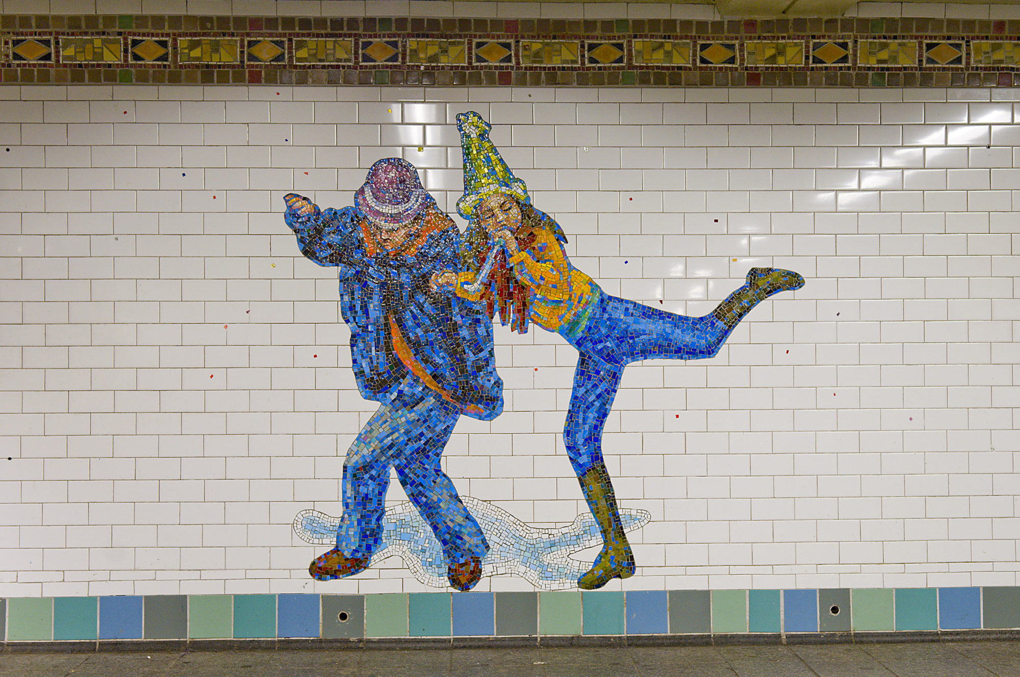 A mosaic at a subway station of two 