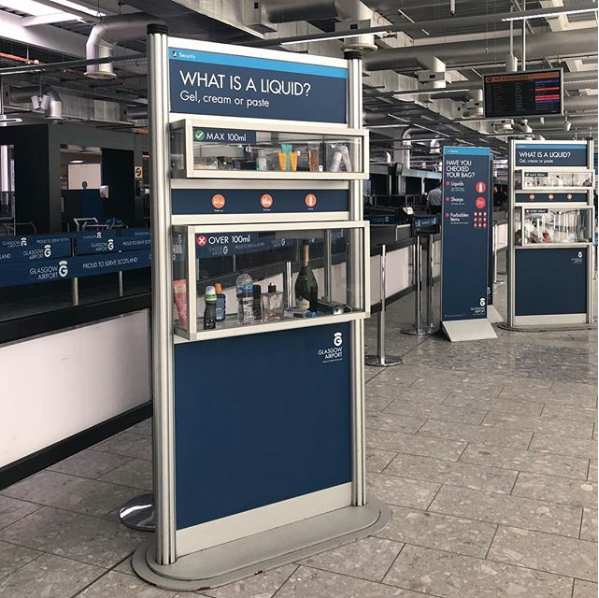 information kiosk in an airport hallway