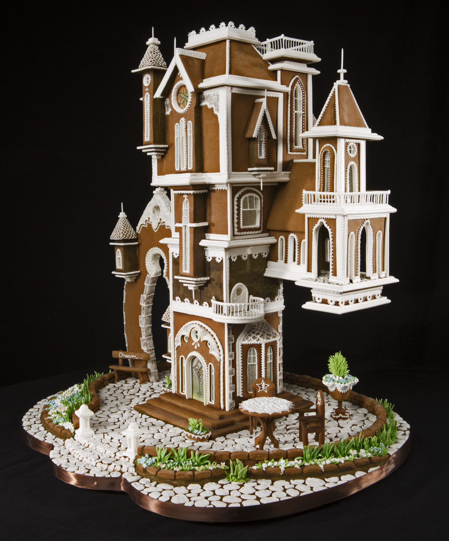 ornate, multi-level gingerbread townhouse with a wrap about patio