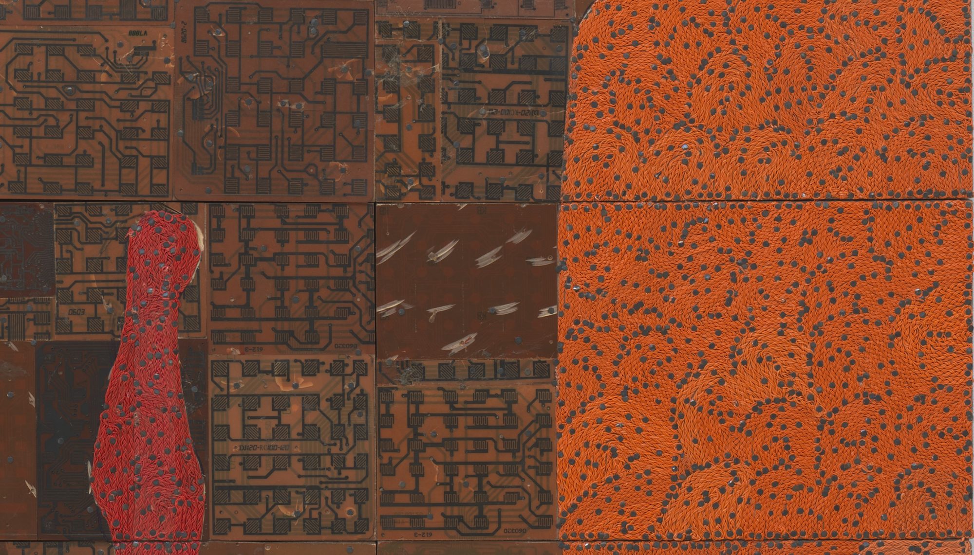 sections of orange, red, and brown patterns in a mosaic