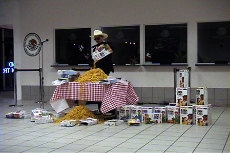 musician pouring large amount of cereal onto table and floor
