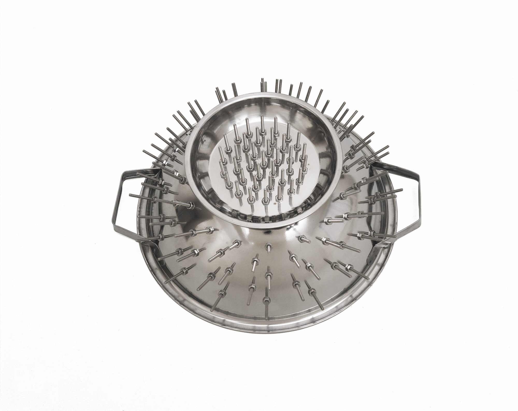 Stainless steel object resembling a pasta drainer, but with rods sticking out in place of holes