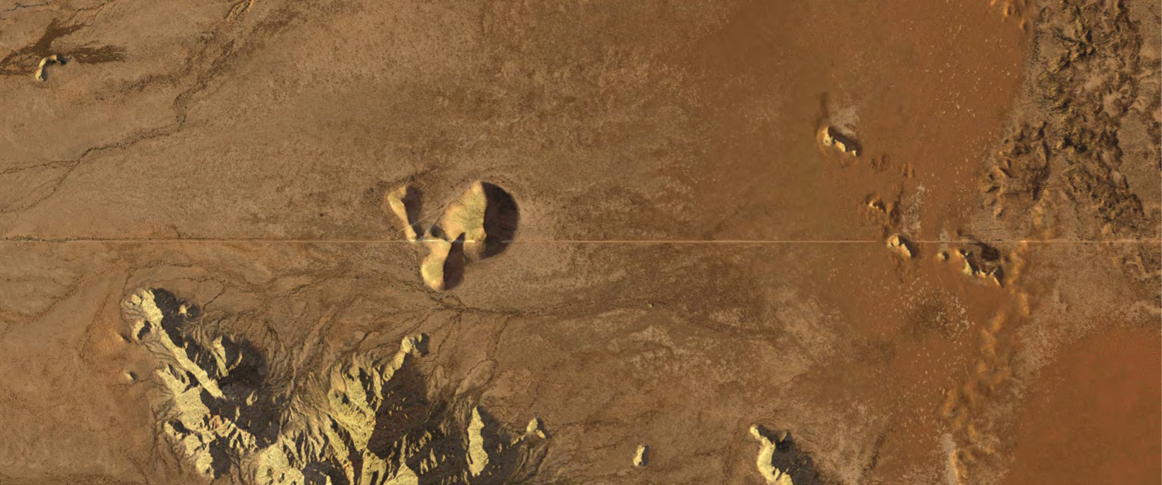 aerial view of body of muddy water and rocks