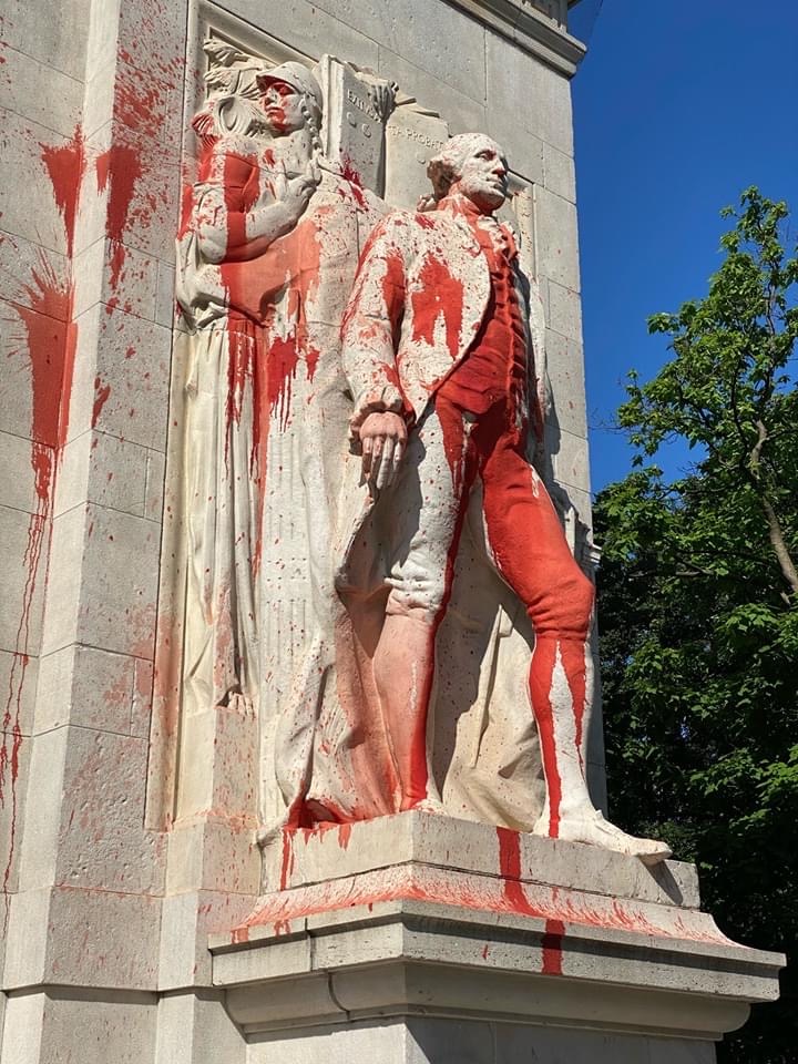 Statue of George Washington in Washington Square Park soaked in red paint