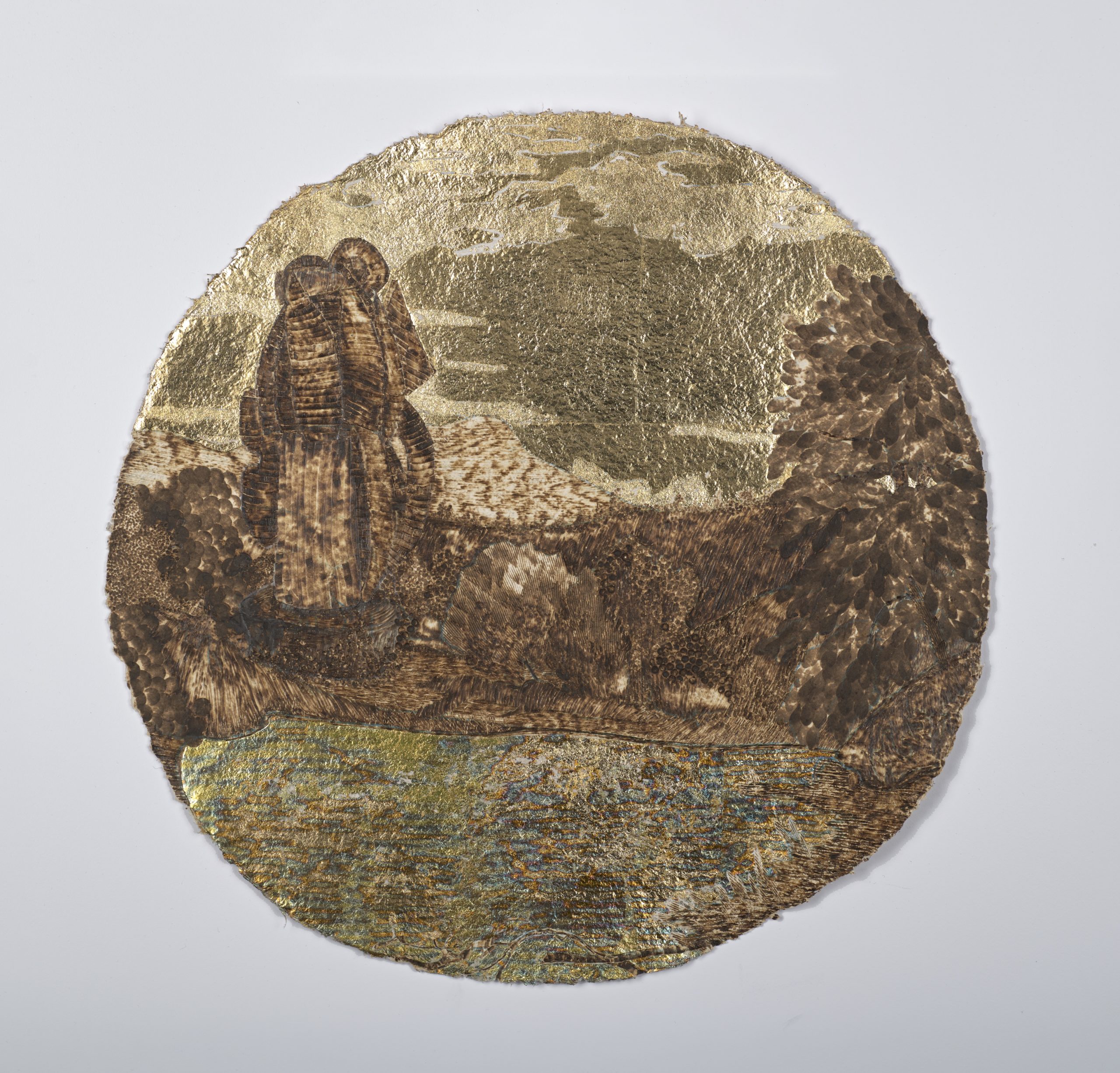 Circular piece of paper depicting figures looking over a vista