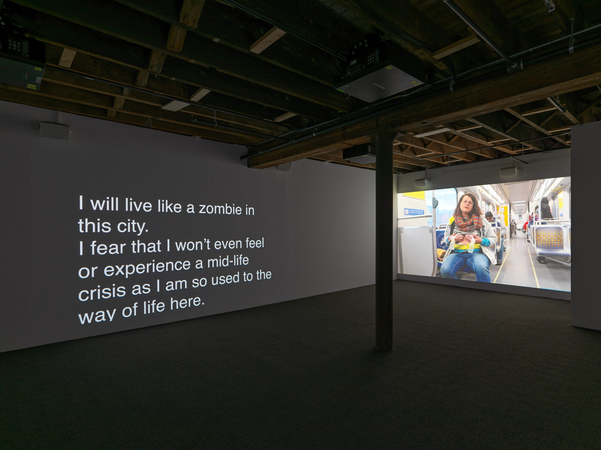 Installation shot of Patty Chang's show, text on the left wall 