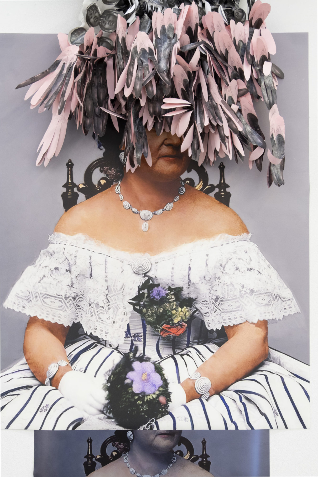 A photograph shows a woman wearing a gown and a large, pink and black sculptural headpiece. She sits and holds a bouquet on her lap.