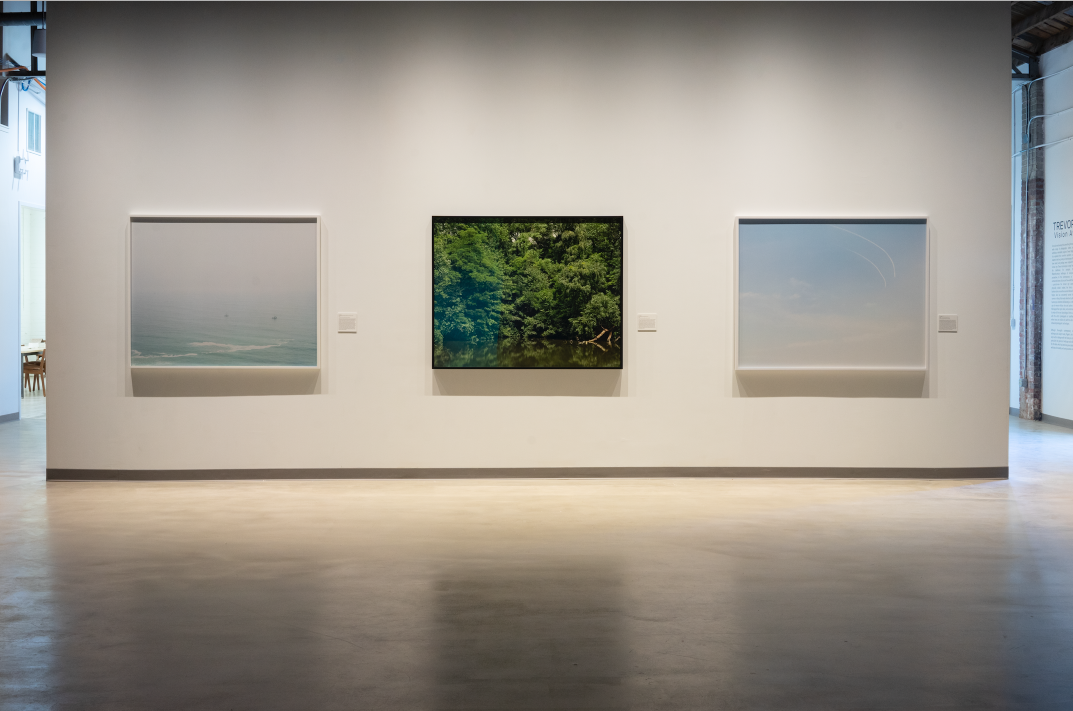 This is an installation view of three photos from artist Trevor Paglen's exhibition 