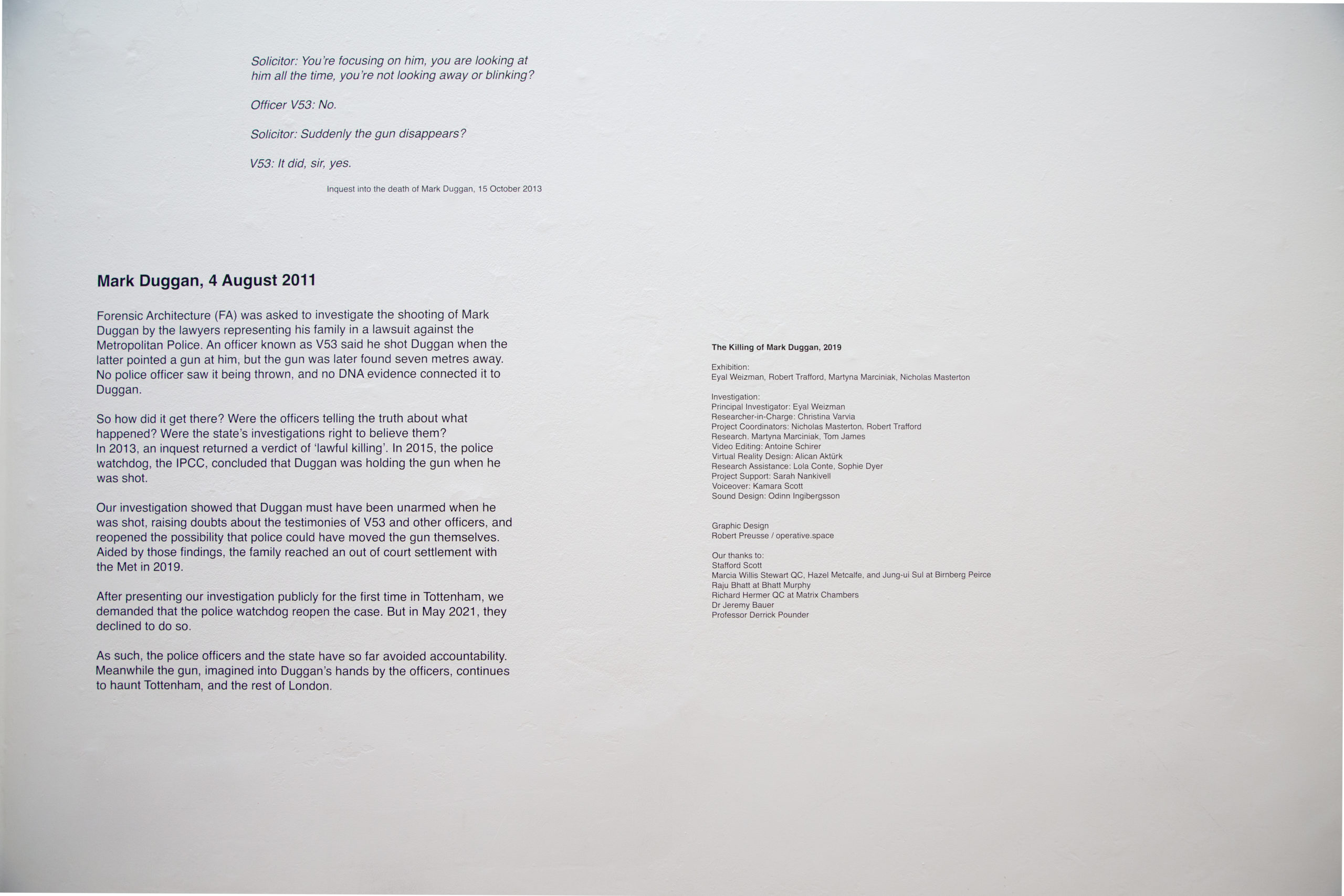 Text on a blank white wall that briefly introduces the Forensic Architecture's investigation of Mark Duggan's death.