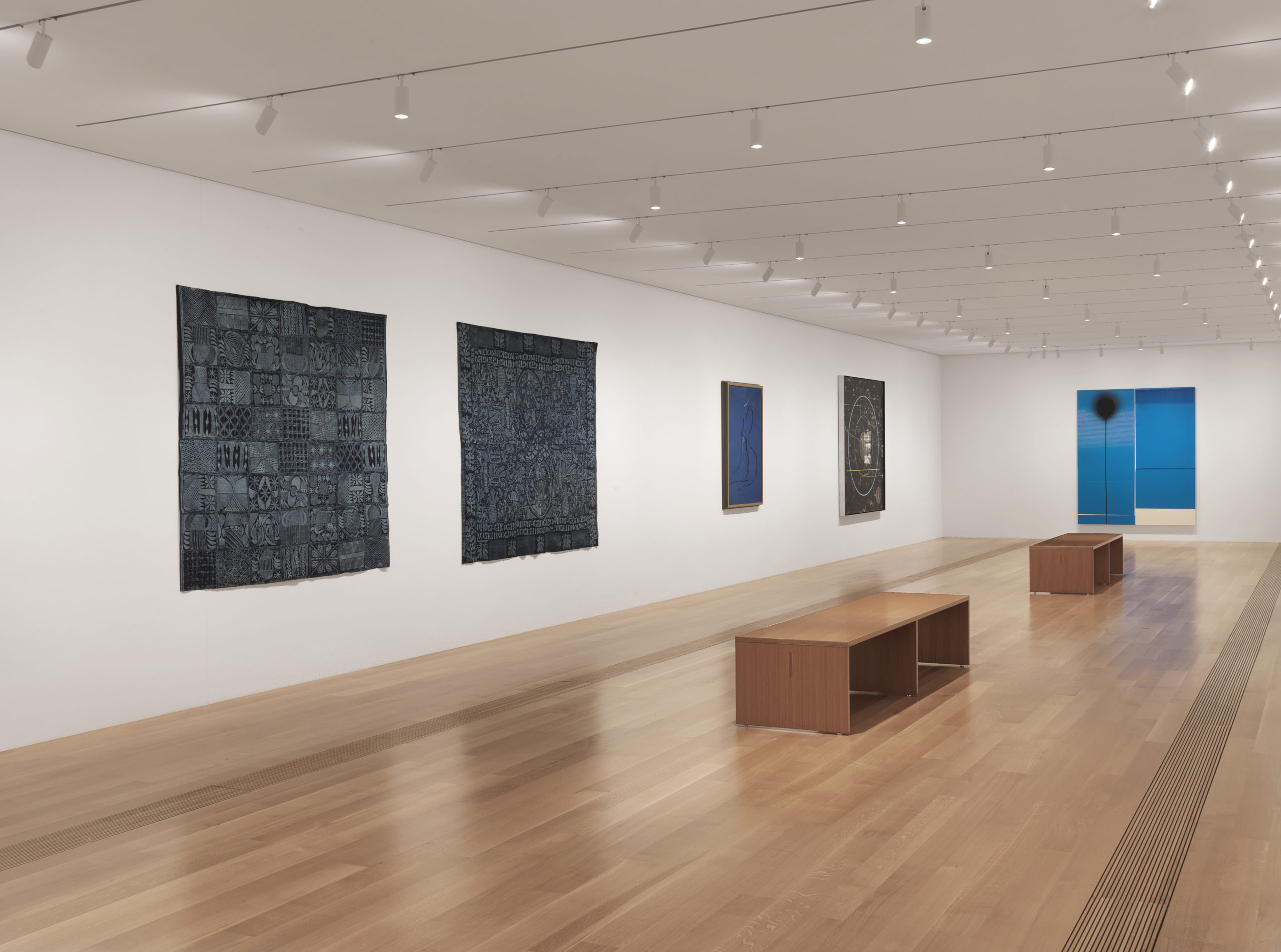 Installation view of the east gallery, with five works in view.