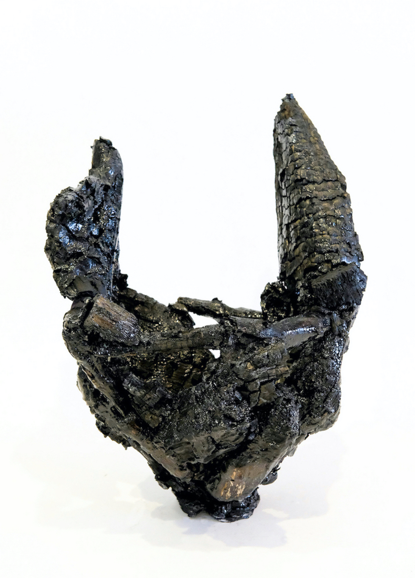 A charred black structure that resembles two horns jutting upwards.