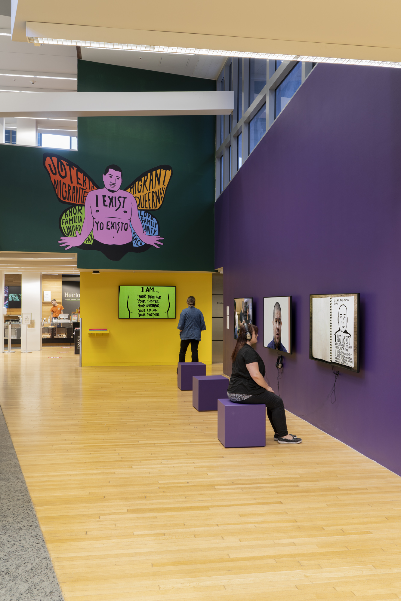 Installation view of people interacting with the exhibit