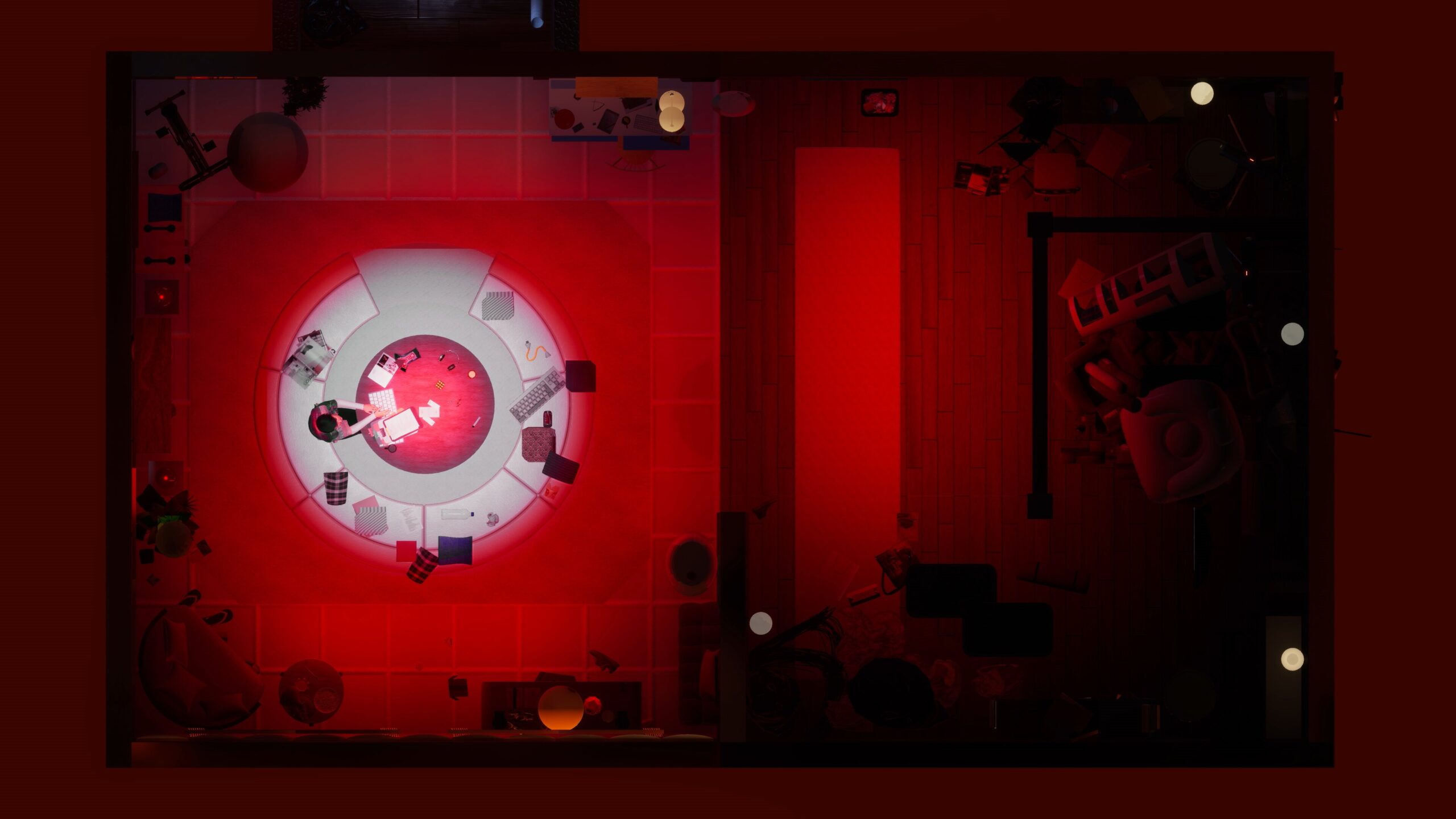 Image of a red screen depicting an aerial view of a circular table that a small figure is sitting at, surrounded by less-focused room clutter.
