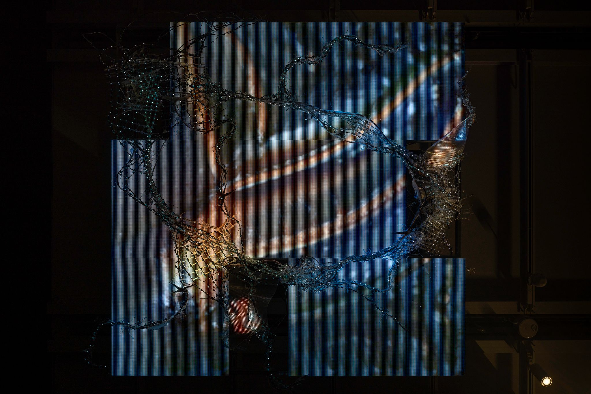 Image is an unrecognizable, abstracted view with orange and dark blue elements.