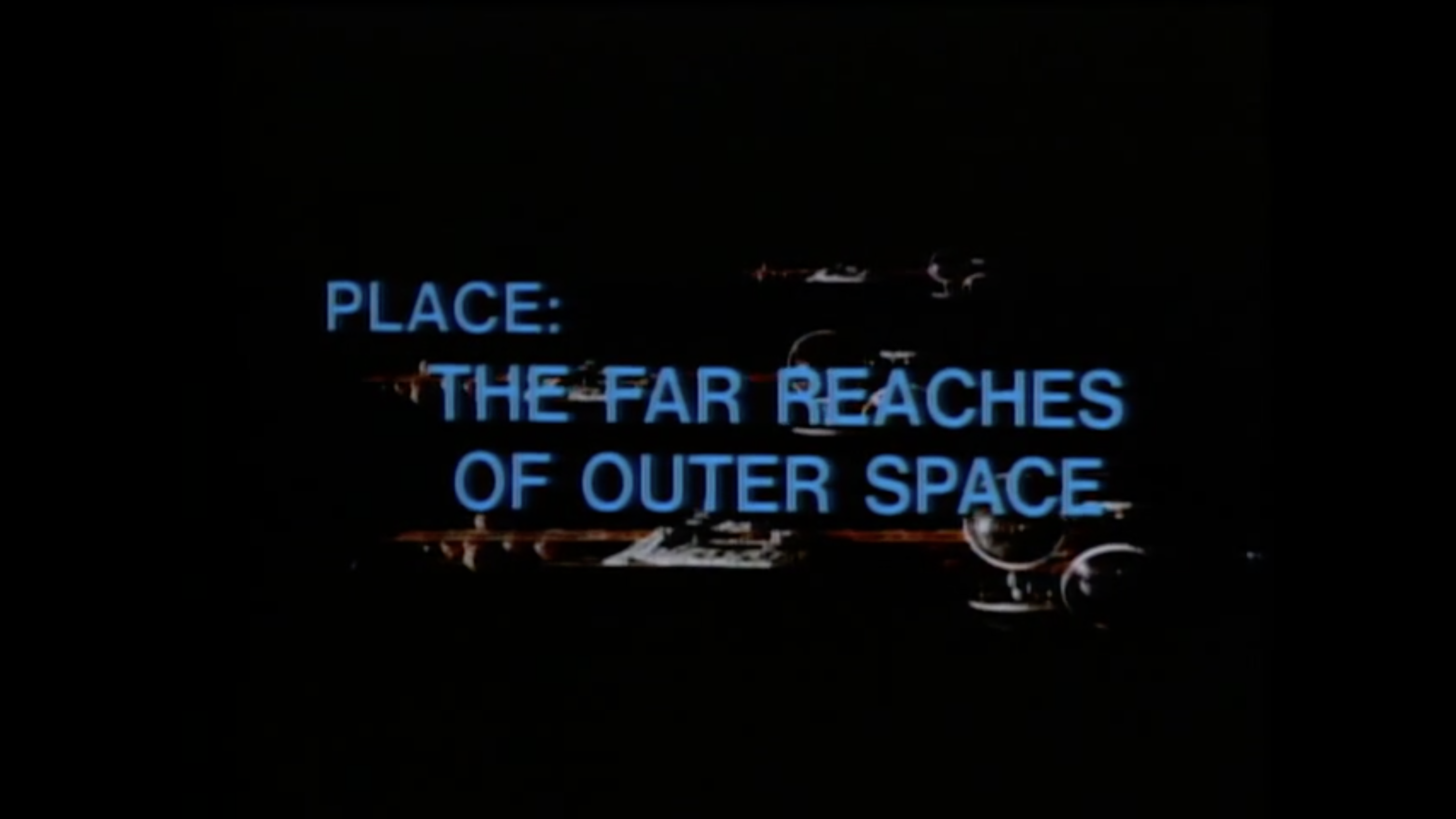 A screenshot of a 1970s video depicting a multi-domed space structure built of metal and glass, with the words, 