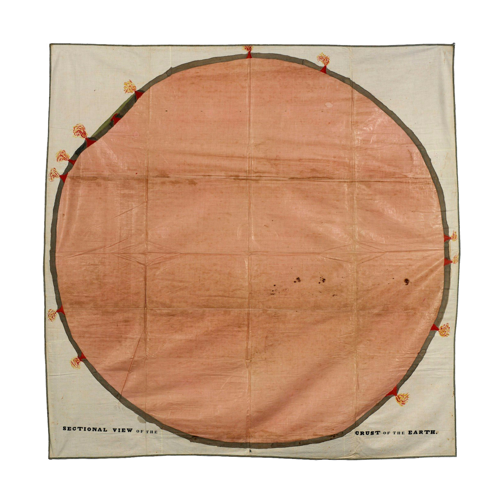 Image of an orange circle, representing the earth, with a brown border on beige fabric.